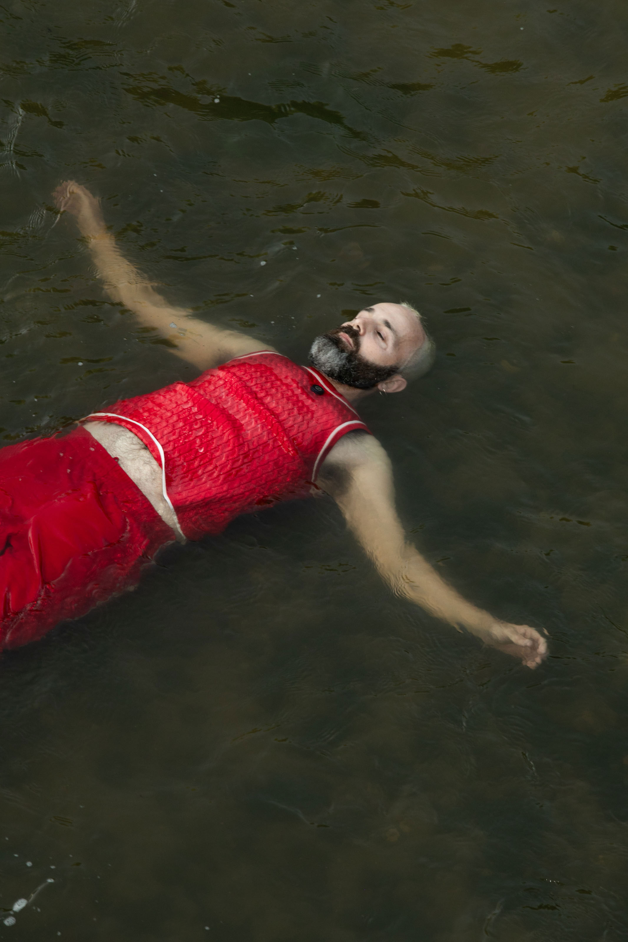 Oscar Bueno floating on the river